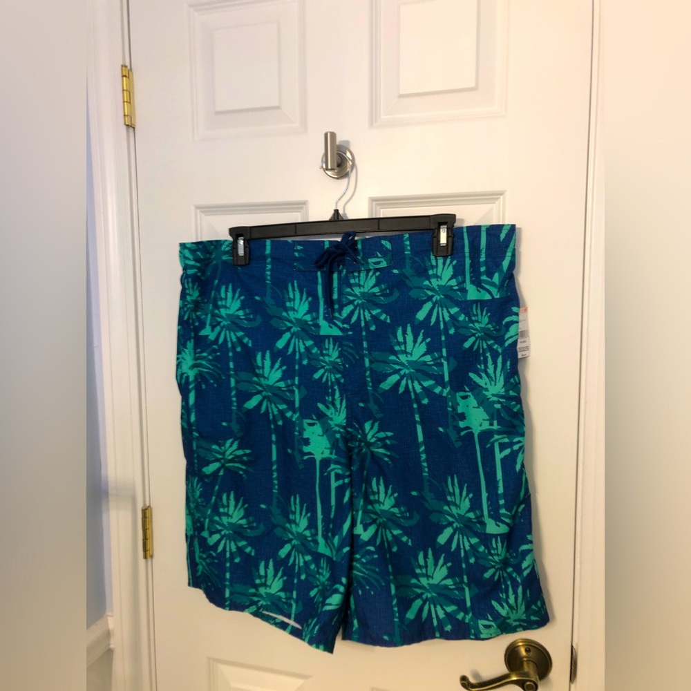 Men’s Bathing Suit.  New with tags.  Size XXL Blue/green print . Side pocket